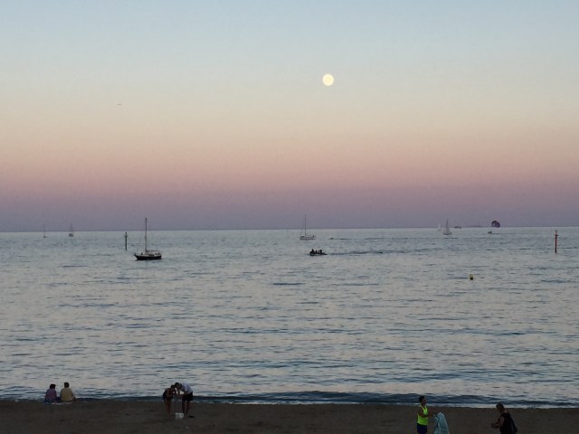 Sun sets over Barcelona beach